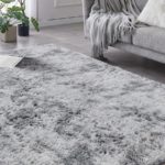 5x7 grey shag area rug in a furnished living room