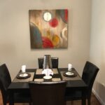 Rental dining table set for four in a furnished apartment